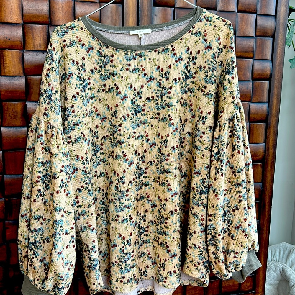 Super soft flowered sweater with fun sleeves.